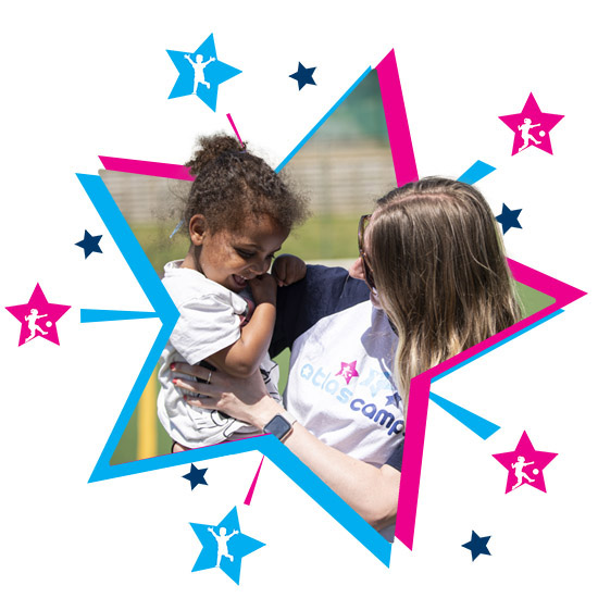 Team of childcare professionals smiling outdoors - seasonal holiday club jobs UK